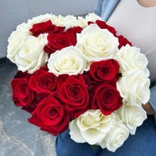 Heart-shaped bouquet of red and white roses