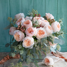 Bouquet of Juliet roses with a distinctive full cupped rose with voluminous petals, that ombré beautifully from soft peach to warm apricot.
