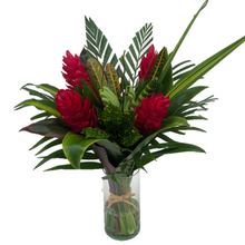 Vase with a red & green tropical bouquet of (1) Banana Fingers, (4) Ginger Red, (6) Cordelyn, (2) Croto Largo, (3) Palm, (2) Pandanus, (1) Pandanus Curly, (1) Tip Cordelyne babydoll, (3) Willow. 
