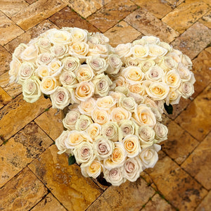 3 bouquets of Cream color roses with hints of purple and orange. 