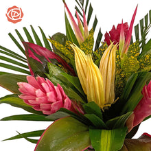 Green, pink & yellow tropical bouquet in vase with (2) Ginger Pink, (1) Ginger Red, (2) Chili Pink Picks, (2) Anglonema, (2) Arrow Palm, (6) Cordelyne, (1) Croton Tip Fountain, (2) Masajeana, (2) Pandanus,. 