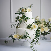 wedding cake with Patience roses with Charming milky buds ruffle out into ivory sculpted cups of delicate, lace-like petals revealing a creamy colored centre with just a hint of pale, buttery yellow.

