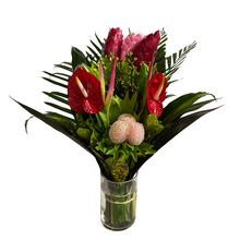 Tropical Bouquet with glass vase (1) Ginger Pink, (3) Ginger Red, (2) Anthurios, (2) Hel. Sassy, (2) Eucaliptos doll, (3) Lettuce Fern, (2) Palma Flecha, (2) Diafembancha, (2) Croto Pecoso, (1) Tip Bronce, (6) Codelines. 